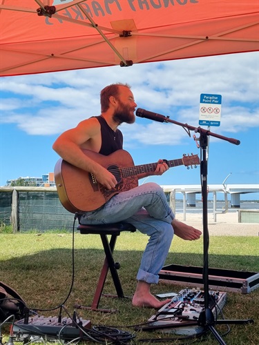 A singer and guitarist performing