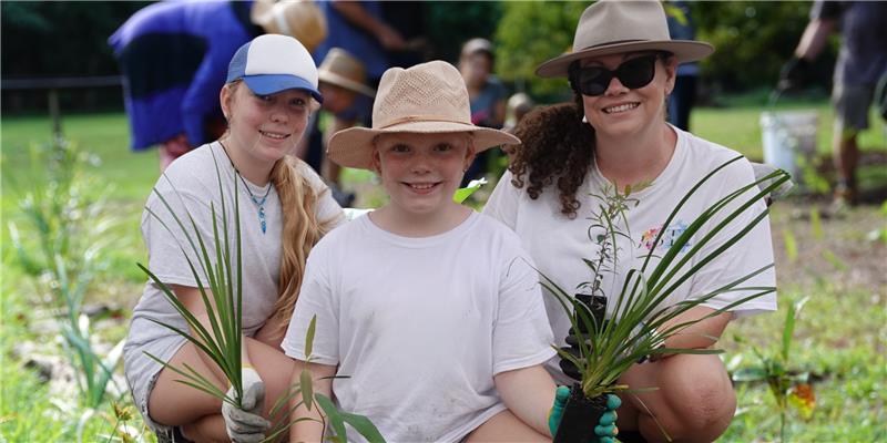 3 people planting together