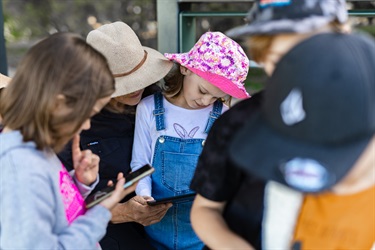 Children playing the app missions